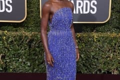 Lupita Nyong'o wore a custom cobalt blue dress with silver drop beads by Calvin Klein.
