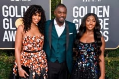 Sabrina Dhowre, Idris Elba, and Isan Elba at the 76th Golden Globe Awards during the red carpet arrivals. Idris wore a three-piece green suit by Ozwald Boateng